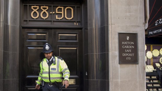 A British police officer leaves a safe deposit building on Hatton Garden.