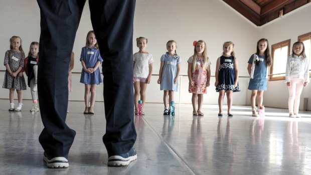 Children try their luck at auditions for the Melbourne production of The Sound of Music. Summer Moore (far right) made it through to the next round for the role of Gretl.