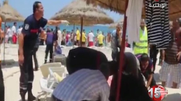 Wounded lie among the deckchairs as paramedics treat the injured.