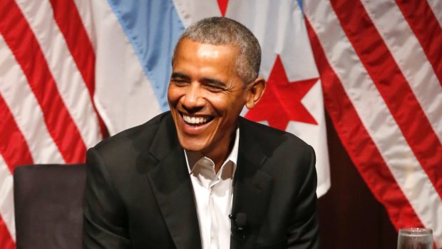 Former President Barack Obama smiles as he hosts a conversation on civic engagement on Monday.