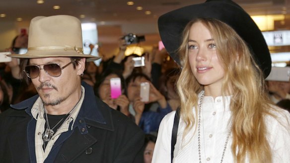 Amber Heard and Johnny Depp, pictured in 2015, will settle their divorce case.