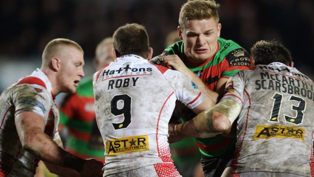 George Burgess runs into a wall of St Helens defenders.