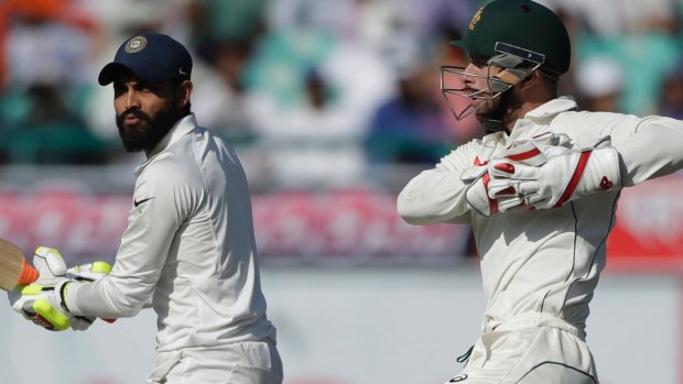 War of words: Ravindra Jadeja and Matthew Wade.