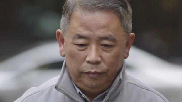 Albert Ooi was sentenced to eight years in jail for conspiracy to defraud and taking a secret commission