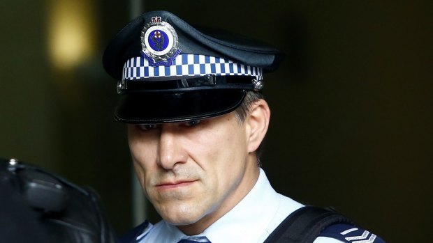 Senior Constable John Wasko leaves the Downing Centre Local Court on Tuesday.