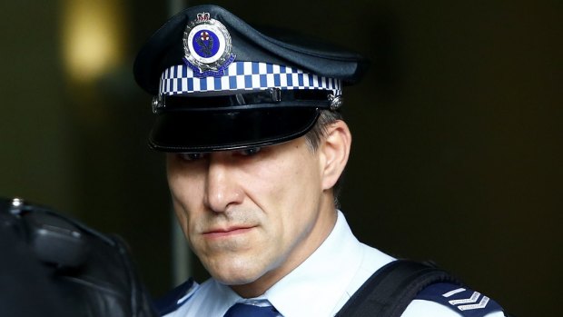 Senior Constable John Wasko leaves the Downing Centre Local Court on Tuesday.