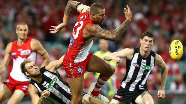 Night to forget: Lance Franklin competes for the ball against Ben Reid.