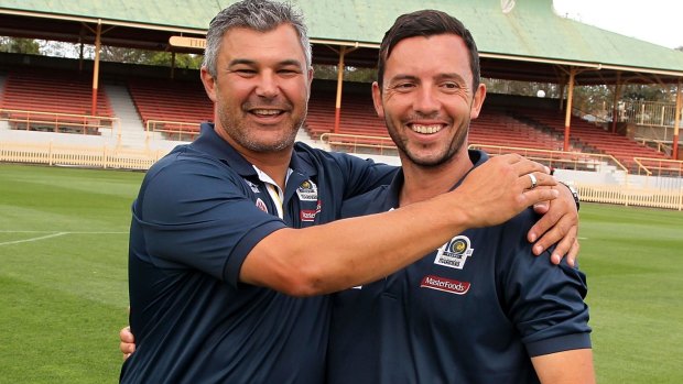 Another legend: Central Coast coach Phil Moss embraces the Mariners' most valuable asset, captain John Hutchinson.