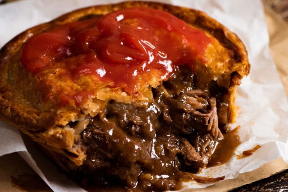 The perfect Aussie meat pie served with sauce, of course.