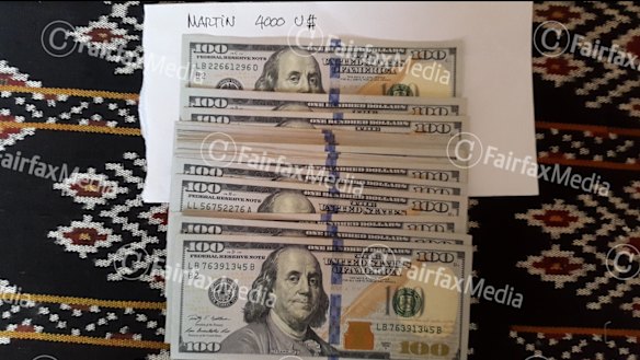 Two of six: Money Indonesian police say was used to pay people traffickers.