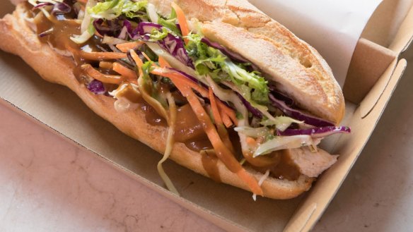 Roast chicken roll with gravy and slaw.  