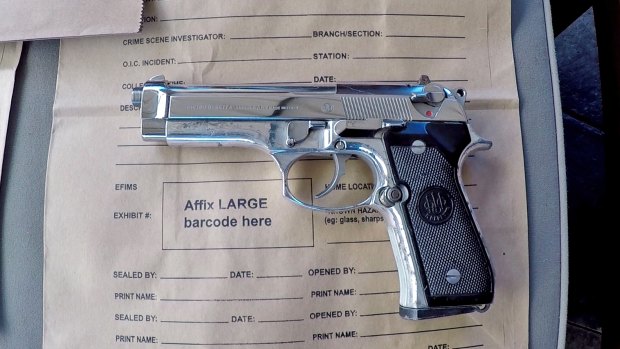 Police seized a loaded semi-automatic handgun during the raid on Wednesday.