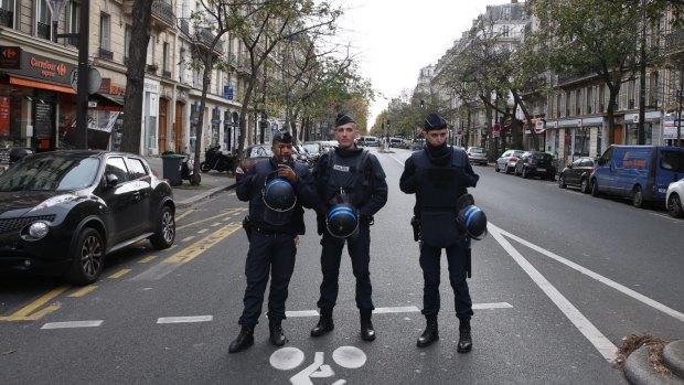 French police guard Boulevard Voltaire near the Bataclan theatre.