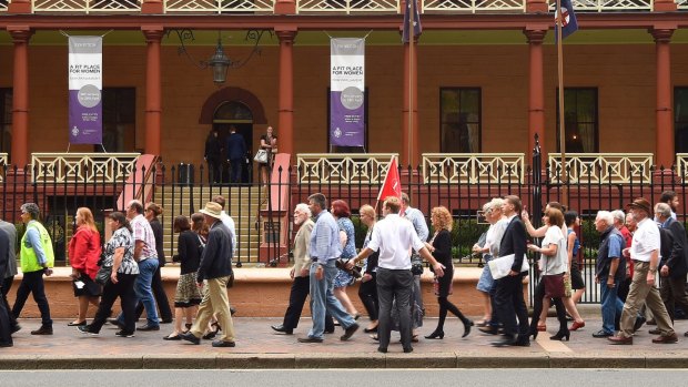Protesters against the LPI privatisation march on NSW Parliament House on Tuesday.