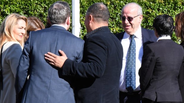 Eddie Obeid with members of his family and legal team during the trial.