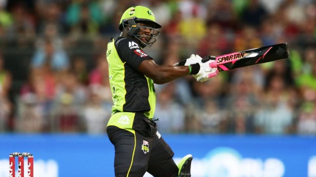 Integrity concern: Andre Russell of the Thunder wields the colourful bat against the Sixers at Spotless Stadium.