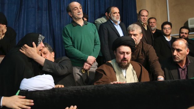 Hassan Khomeini, centre, grandson of Iran's Ayatollah Khomeini, mourns over the coffin of former president Ali Akbar Hashemi Rafsanjani, as Rafsanjani's son Mehdi, second from left, comforts his sister Fatemeh at the Jamaran mosque in Tehran on Sunday.