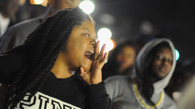 Protestors demonstrate outside the Ferguson Police Department on Wednesday.