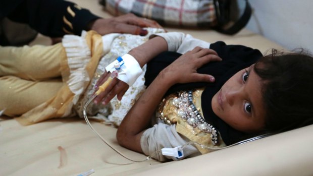 A girl is treated for suspected cholera infection at a hospital in Sanaa, Yemen.