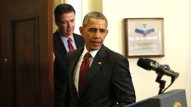 President Barack Obama and the FBI's director, James Comey, arrive for a White House press conference in happier times.