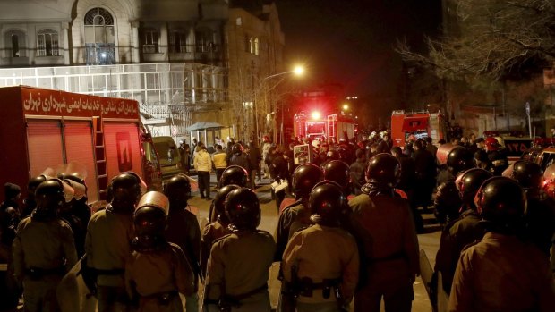 Iranian security mass outside Saudi Arabia's embassy in Tehran ahead of protests that turned violent.