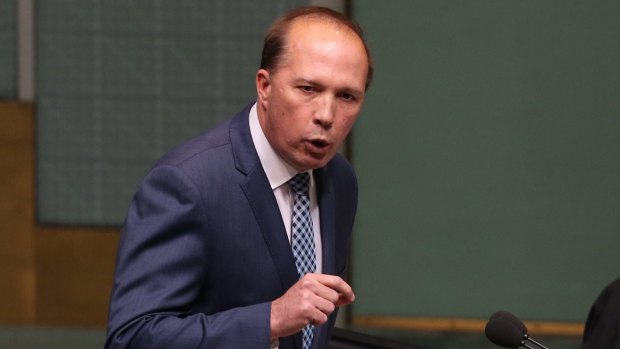 Immigration Minister Peter Dutton, pictured in Question Time on Monday, has called on Labor to reconsider its opposition to the refugee visa ban.
