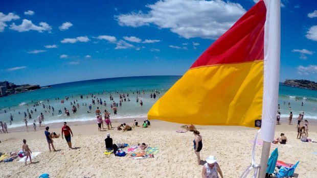 A woman is in hospital after she was pulled from the surf at Bondi Beach.