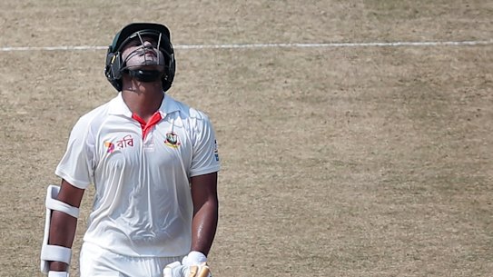 Bangladesh's Shakib Al Hasan walks back to the pavilion after his dismissal by Ashton Agar.