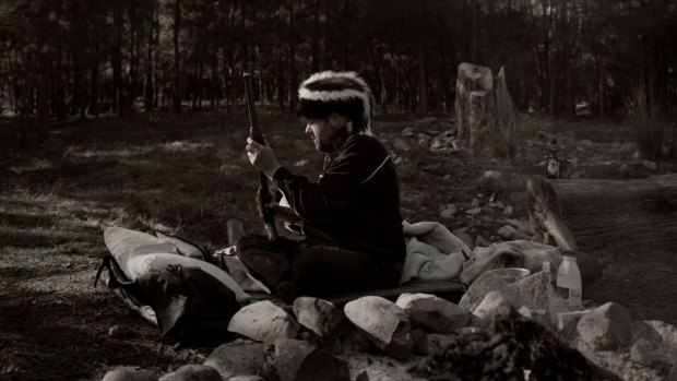 Out there: Adam Cullen gets his gun during the central NSW camping trip he shared with the author, Erik Jensen. 