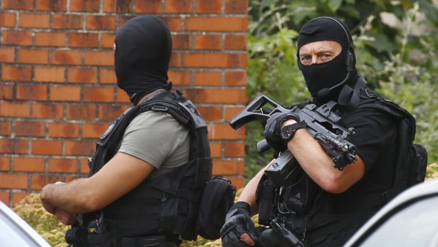 Police officers in Normandy following an attack on a church that left a priest dead.