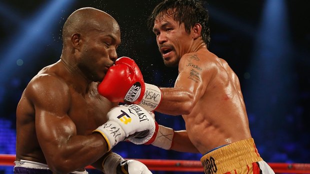 Manny Pacquiao (right) lands a left to the chin of Timothy Bradley in their April 2016 bout.