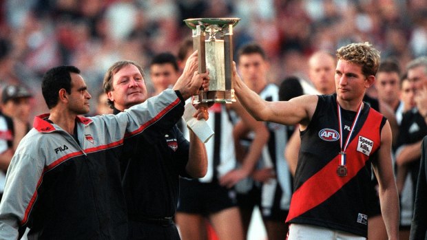 Respect: Michael Long, Kevin Sheedy and James Hird with the Anzac Trophy.