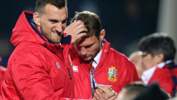 Sam Warburton celebrates on the sideline with teammates following their 12-3 win over the  Crusaders.
