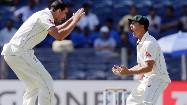 Big game player: Mitchell Starc celebrates the dismissal of Virat Kohli in the first Test.