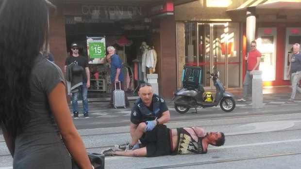 Police used pepper spray to subdue a man after being called to an Acland Street brawl just before 7pm.