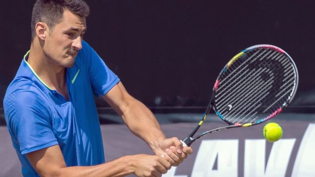 Bernard Tomic has survived the first round at his third successive tournament.