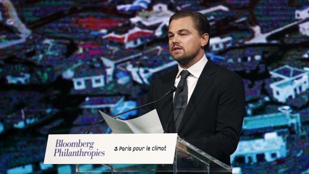 American actor Leonardo DiCaprio delivers a speech during a meeting of mayors from around the world at the Paris city hall on Saturday. The meeting coincided with the UN Climate Conference and carried an environmental theme.