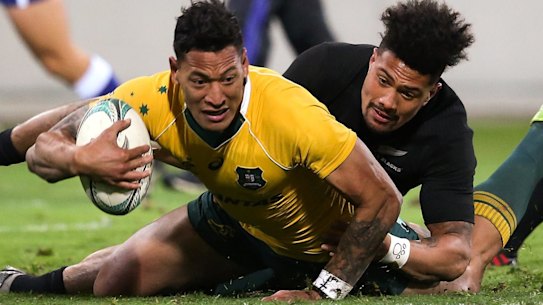 Israel Folau is tackled by Ardie Savea in Wellington. 