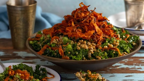 Toasted freekeh salad topped with crispy carrot.