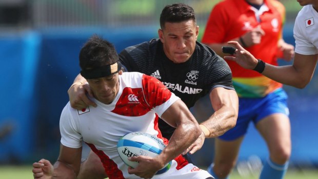 Yusaku Kuwazuru of Japan is tackled by Sonny Bill Williams of New Zealand during the men's Rugby Sevens Pool C match on Day 4 of Rio 2016.