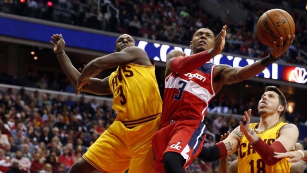 Rivals: Cleveland's Dion Waiters tries to prevent Washington guard Bradley Beal from scoring.
