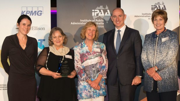 The 2015 gold winners of the Prime Minister's awards for excellence in public sector management: staff from the Tasmanian Education Department with federal Human Services Minister Stuart Robert and the Institute of Public Administration Australia's ACT president, Glenys Beauchamp.