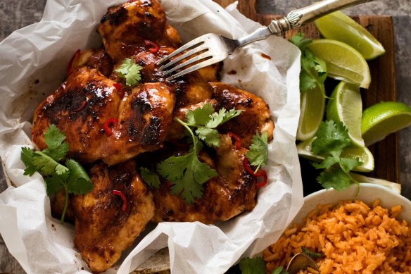 Vietnamese chicken served with red rice and coleslaw.