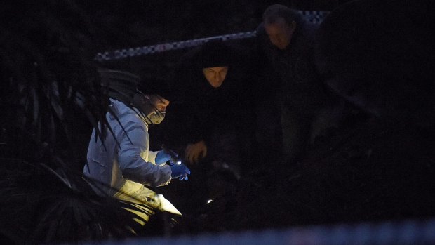 By nightfall, forensic officers in white suits were huddled over the bones with torchlights.