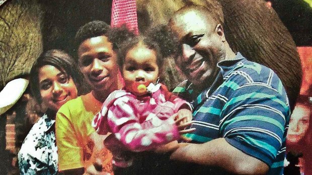 Happier times: Eric Garner and his family.    