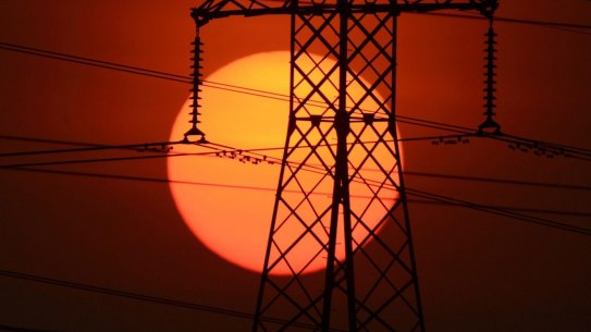 FAIRFAX GENERICS 23/01/07 - A generic photo of the sun setting behind high voltage powerlines , electricity , solar , power , global warming alternative energy , fossil fuel   Pic Glenn Campbell