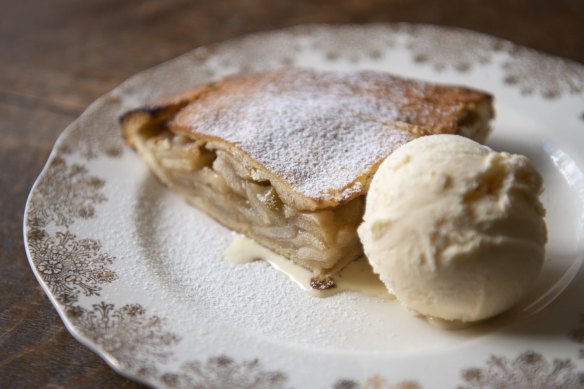 A wedge of Ben's apple pie with vanilla ice-cream.