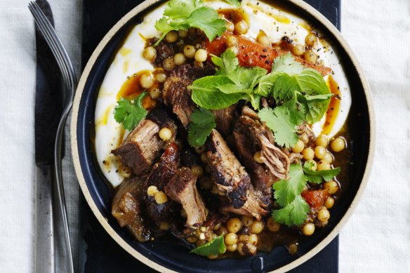 Serve this slow-roasted  lamb with greens, thick yoghurt and bread. 