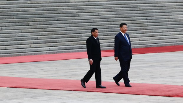 President of the Philippines Rodrigo Duterte, left, and Chinese President Xi Jinping attend a welcoming ceremony on Thursday.