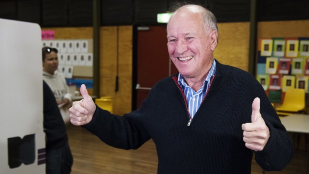 Independant candidate for New England, Tony Windsor casts his vote at Werris Creek Public School with his wife Lyn. 